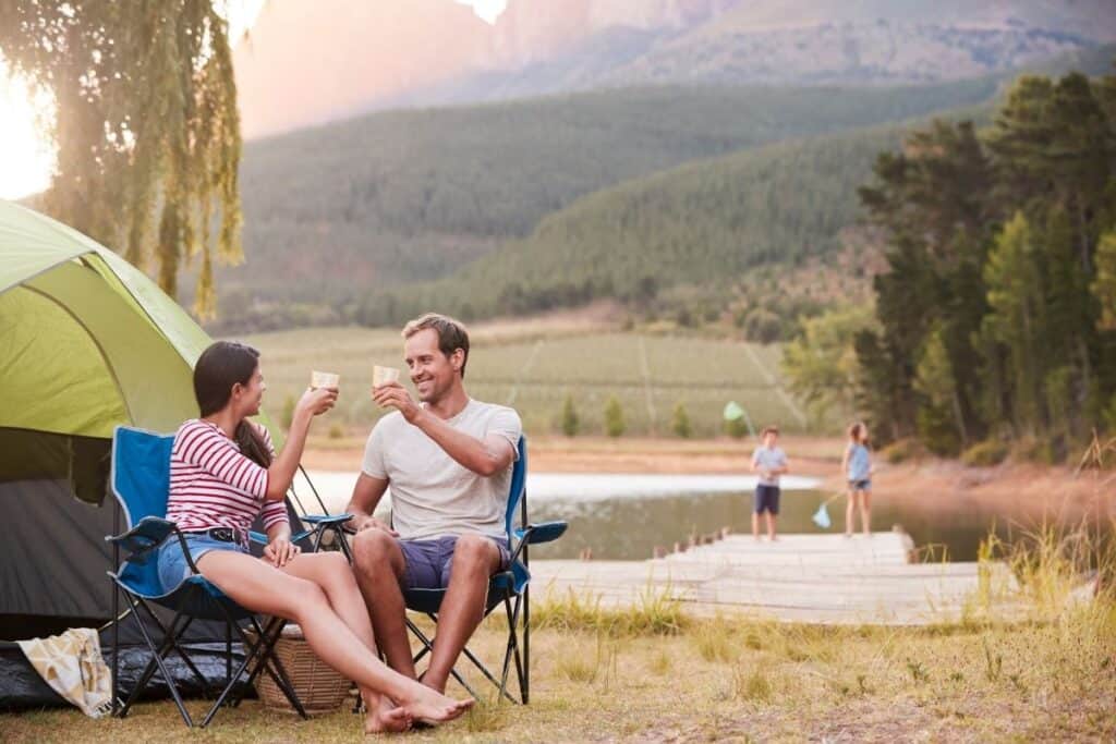 family enjoying camping trip in nice weather