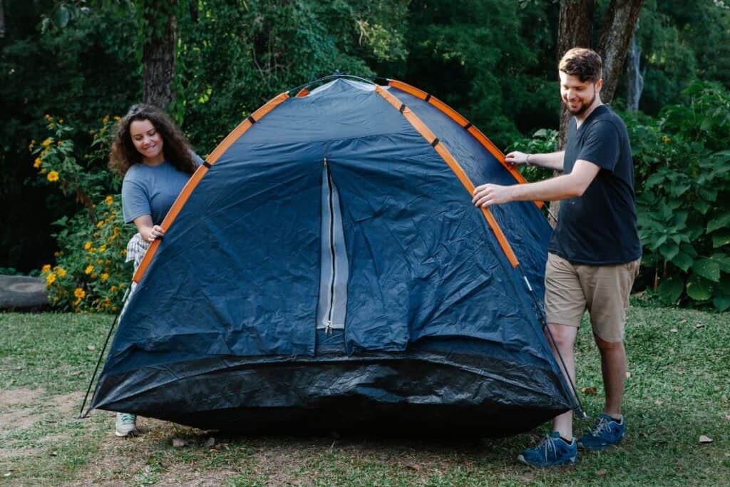 couple pitching tent