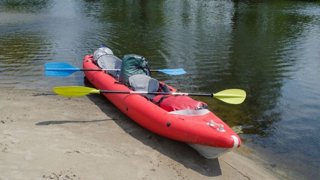 Inflatable kayak with paddles and dry bags